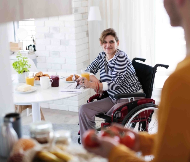 woman in wheelchair at home